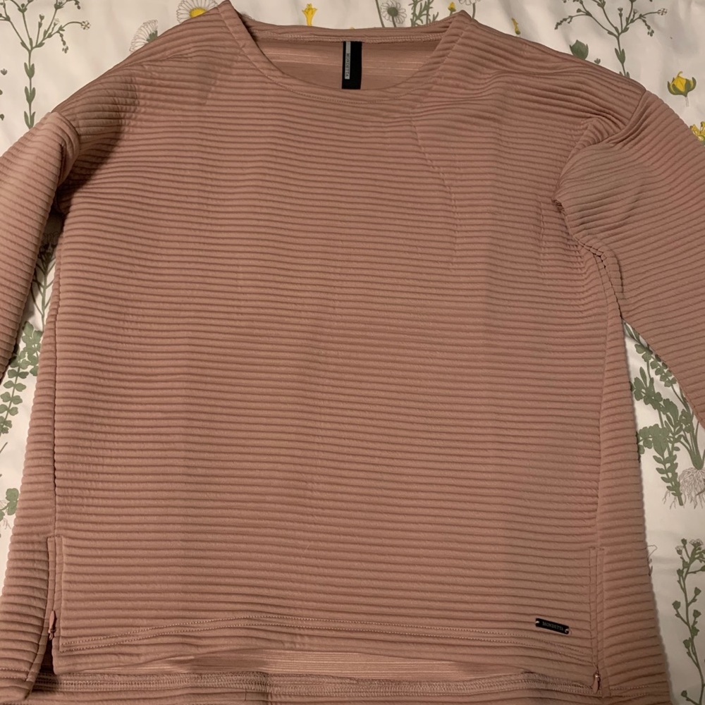 Woman’s blush pink sweater